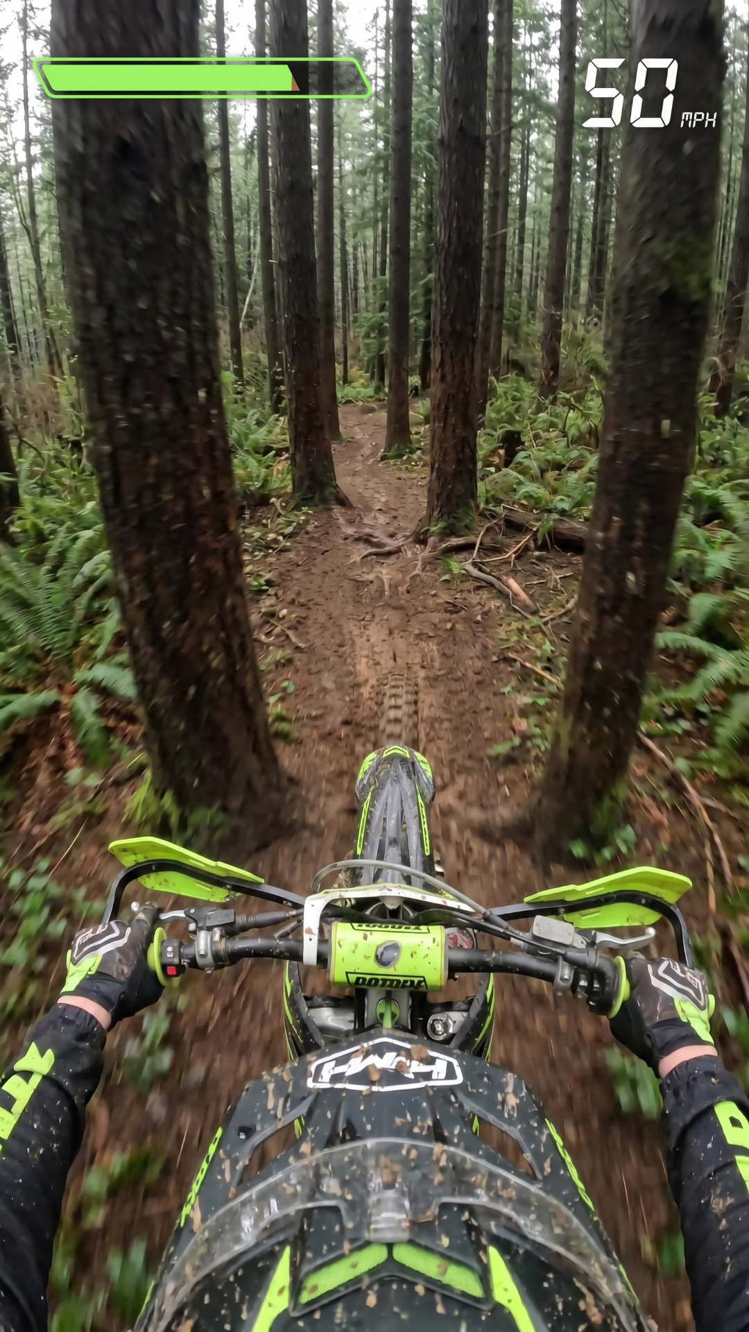 pov view of guy on a dirt bike Moving at high speed in in a muddy forrest he has to dodge the trees he should go through 3 sets of tree hurdles then add one fail scene and oone completion scene where he goes up a muddy ramp then soars in the air in victory