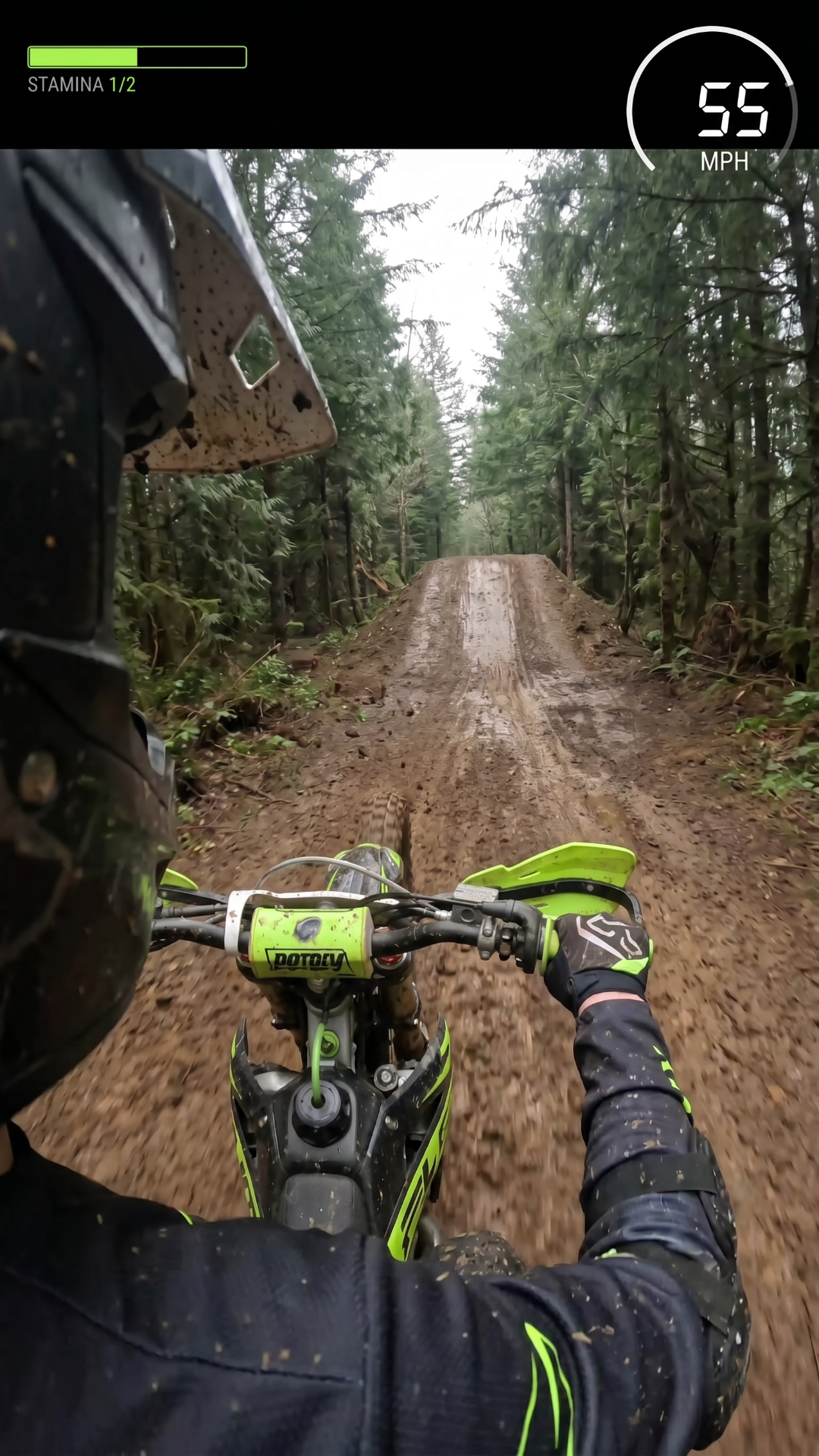 pov view of guy on a dirt bike Moving at high speed in in a muddy forrest he has to dodge the trees he should go through 3 sets of tree hurdles then add one fail scene and oone completion scene where he goes up a muddy ramp then soars in the air in victory